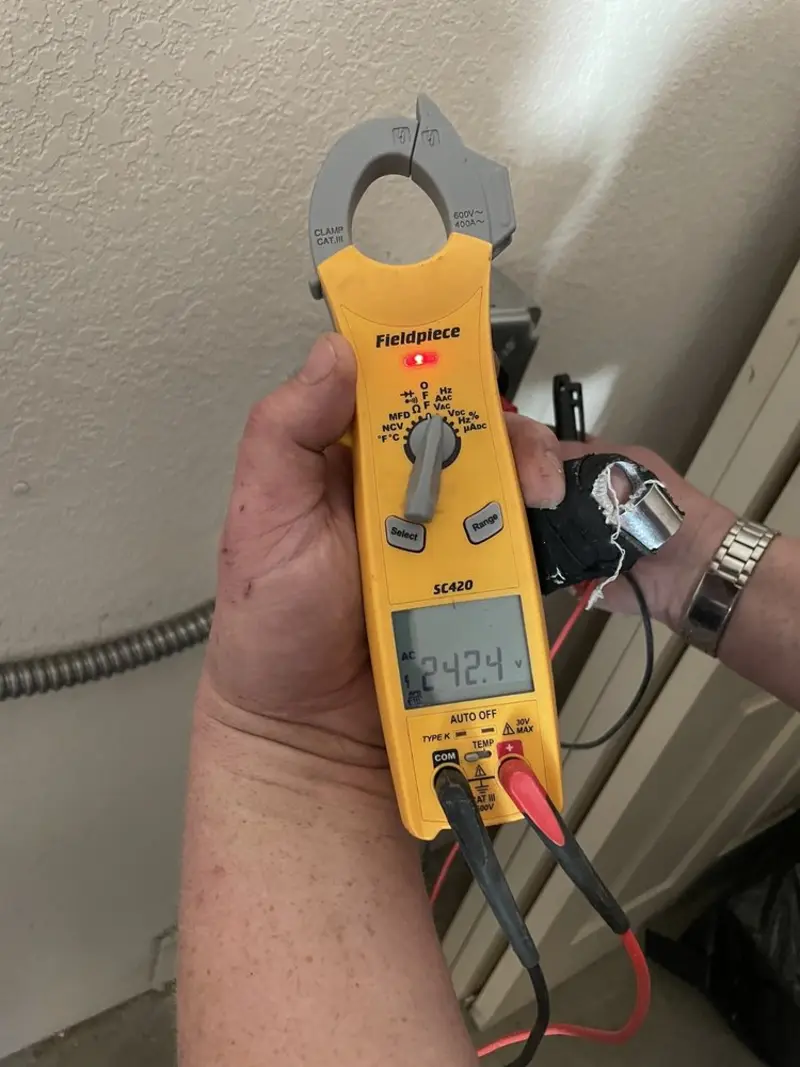 Voltage testing with clamp meter during Electrical Installation Services in Spotswood